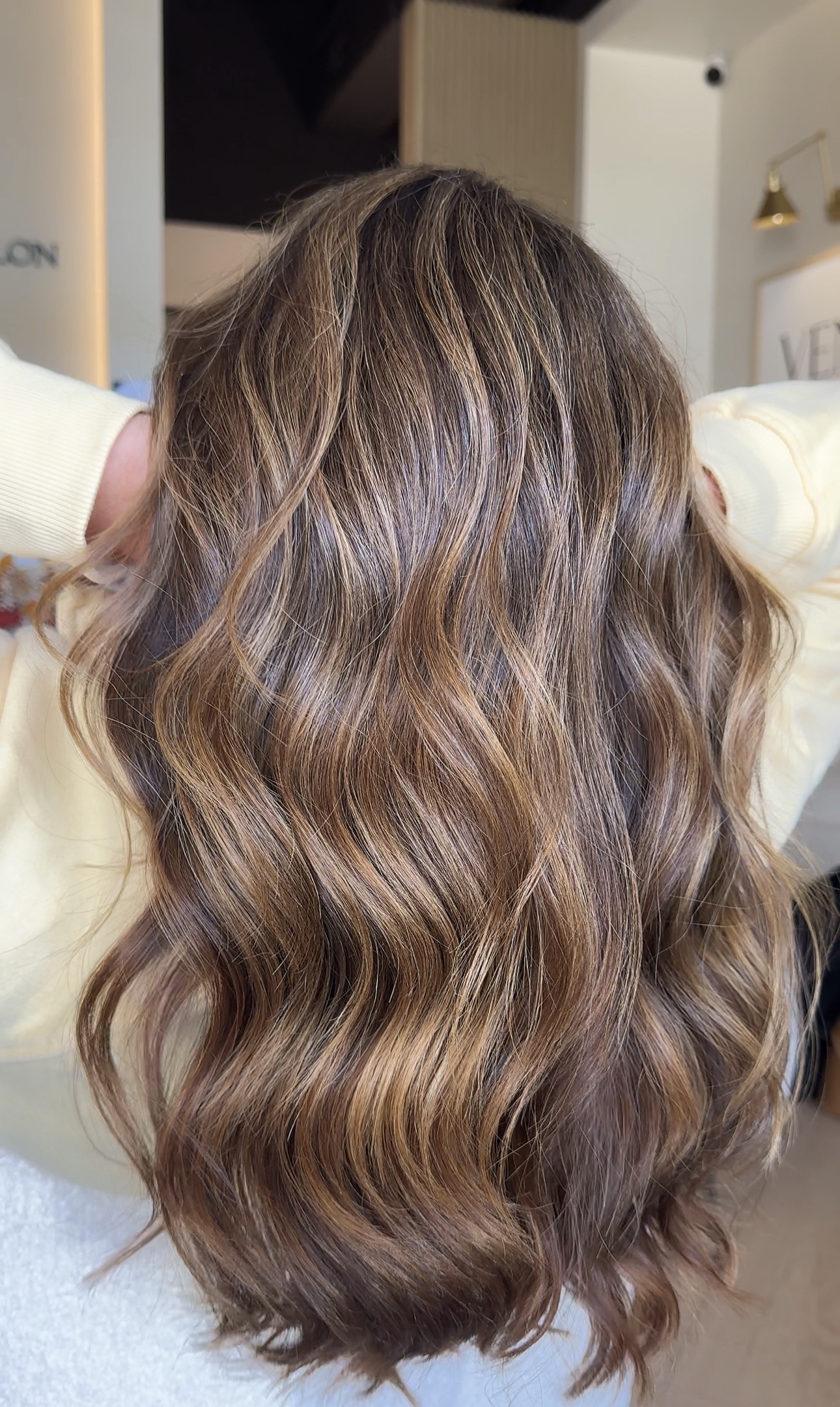 Warm caramel dimensional brunette by Aaliyah at AMAVI Salon