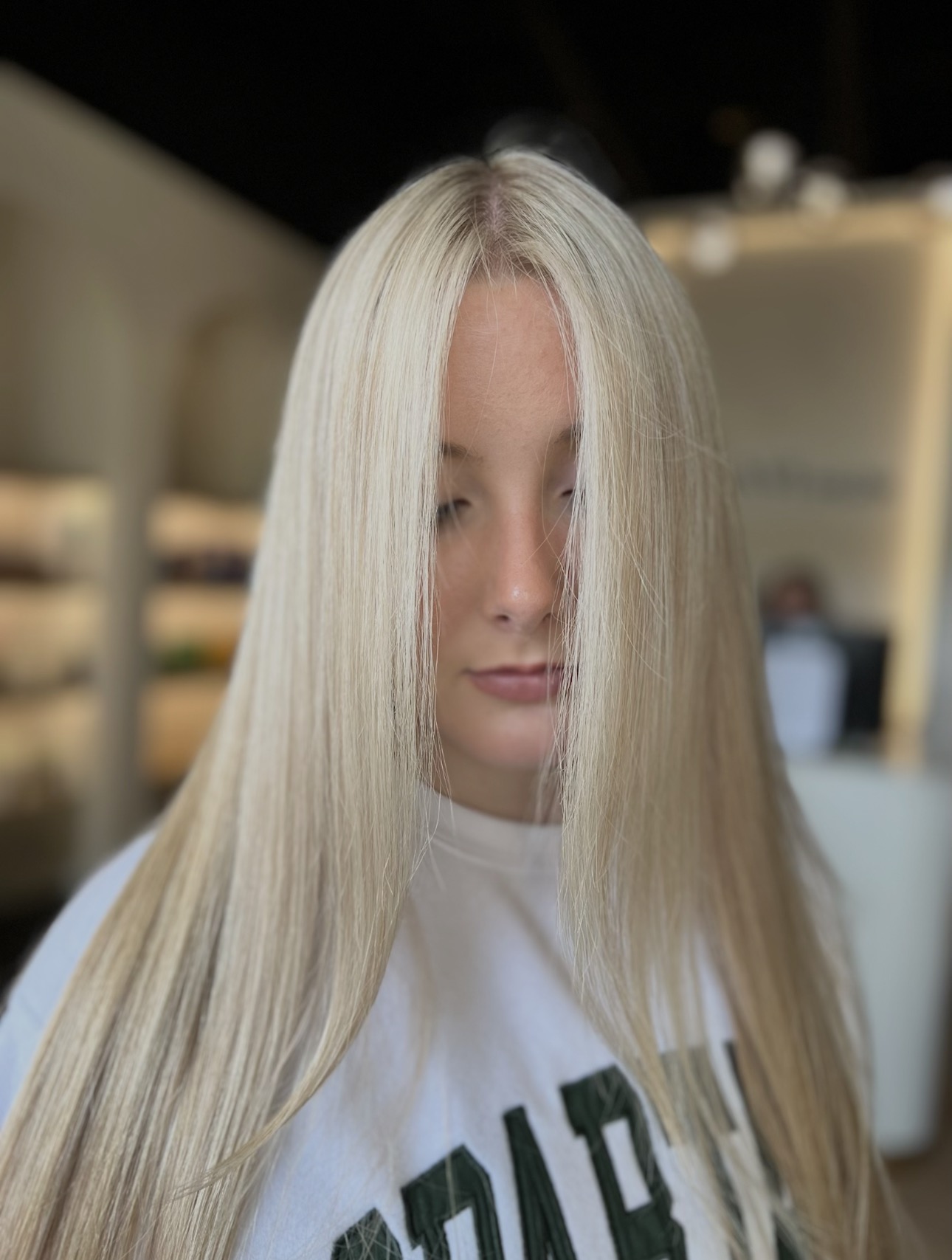 Bright polished blonde with a sleek finish by Ariella at AMAVI Salon