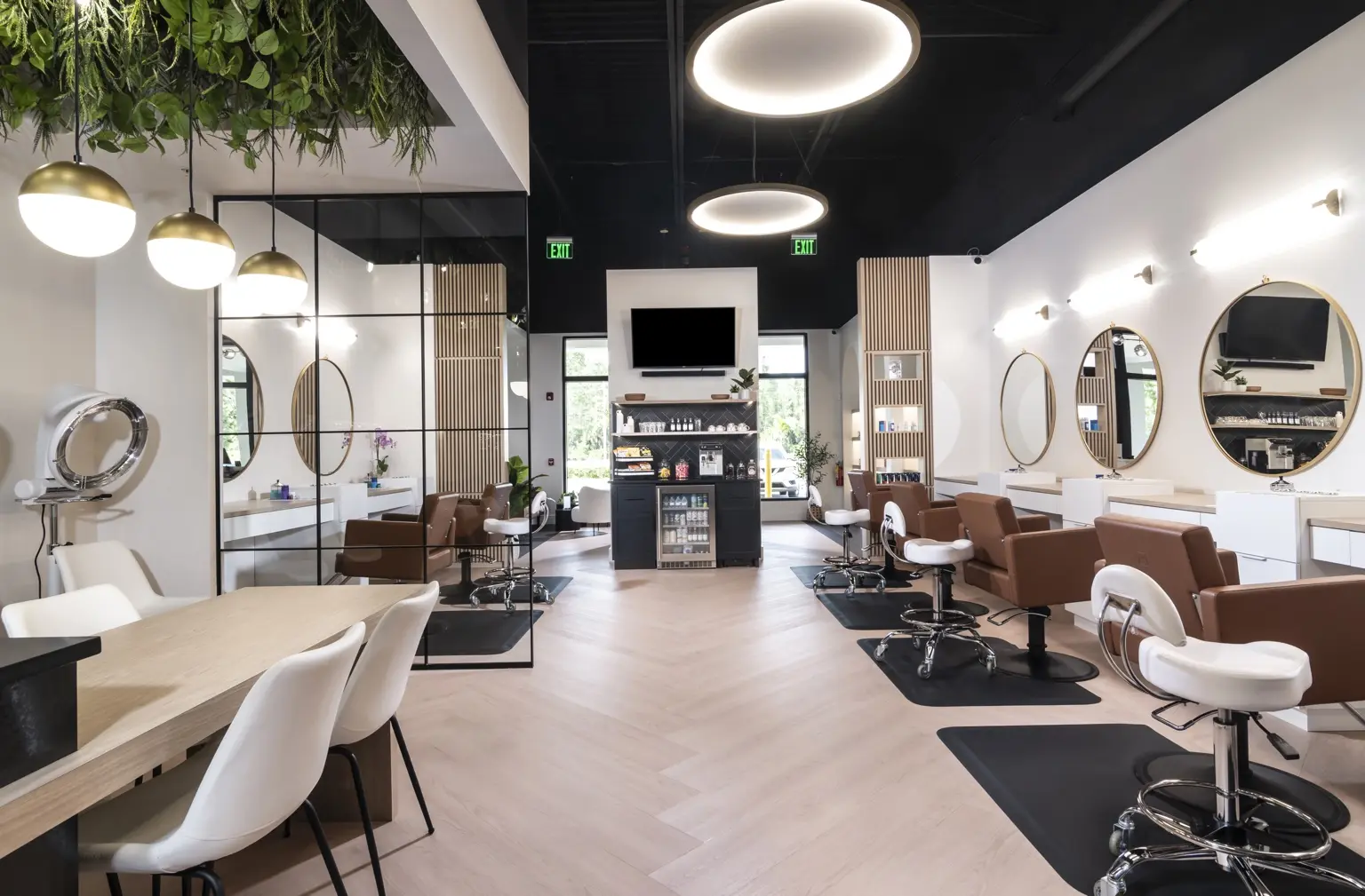 Styling stations and warm details inside AMAVI Salon