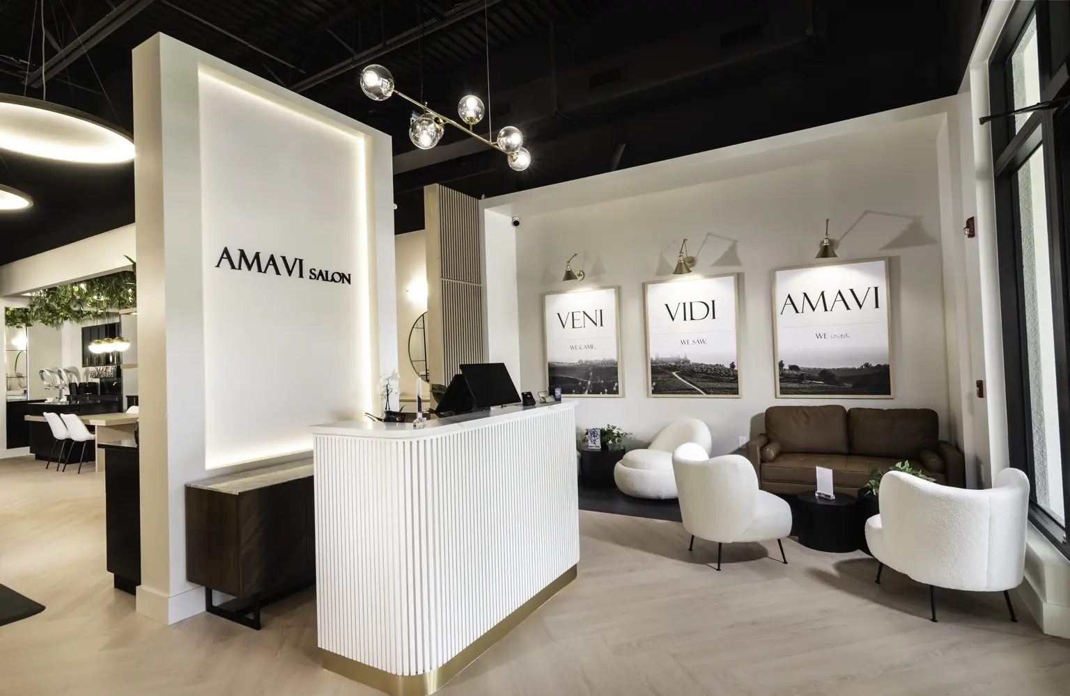 The welcoming reception and guest lounge inside AMAVI Salon in Naples, Florida